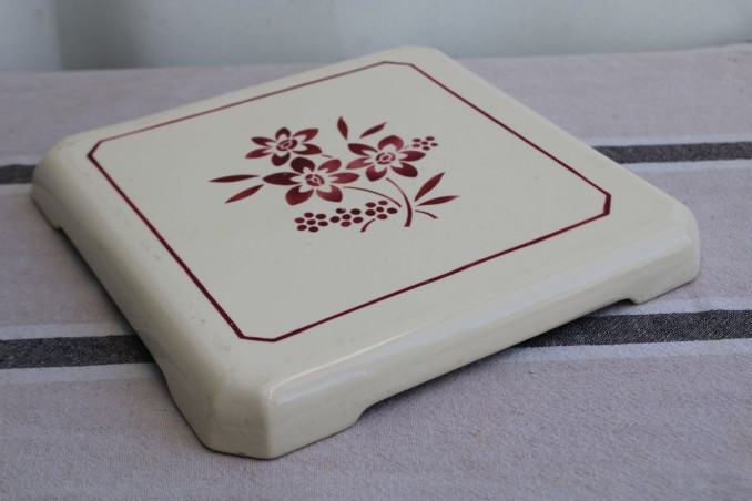 Ancien dessous de plat en porcelaine